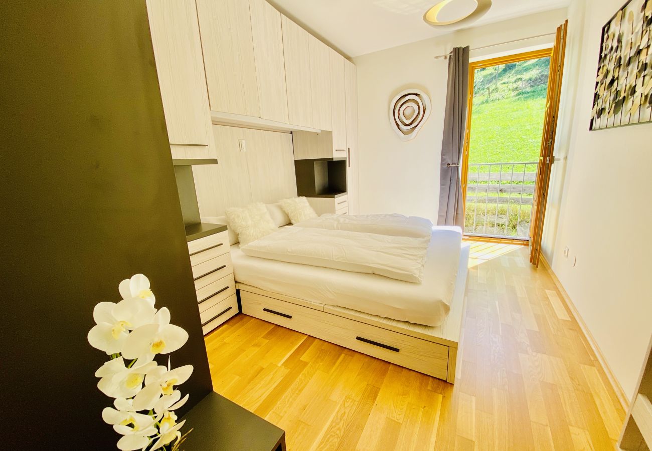 The bedroom is not only comfortable but also has a unique view of the mountains.