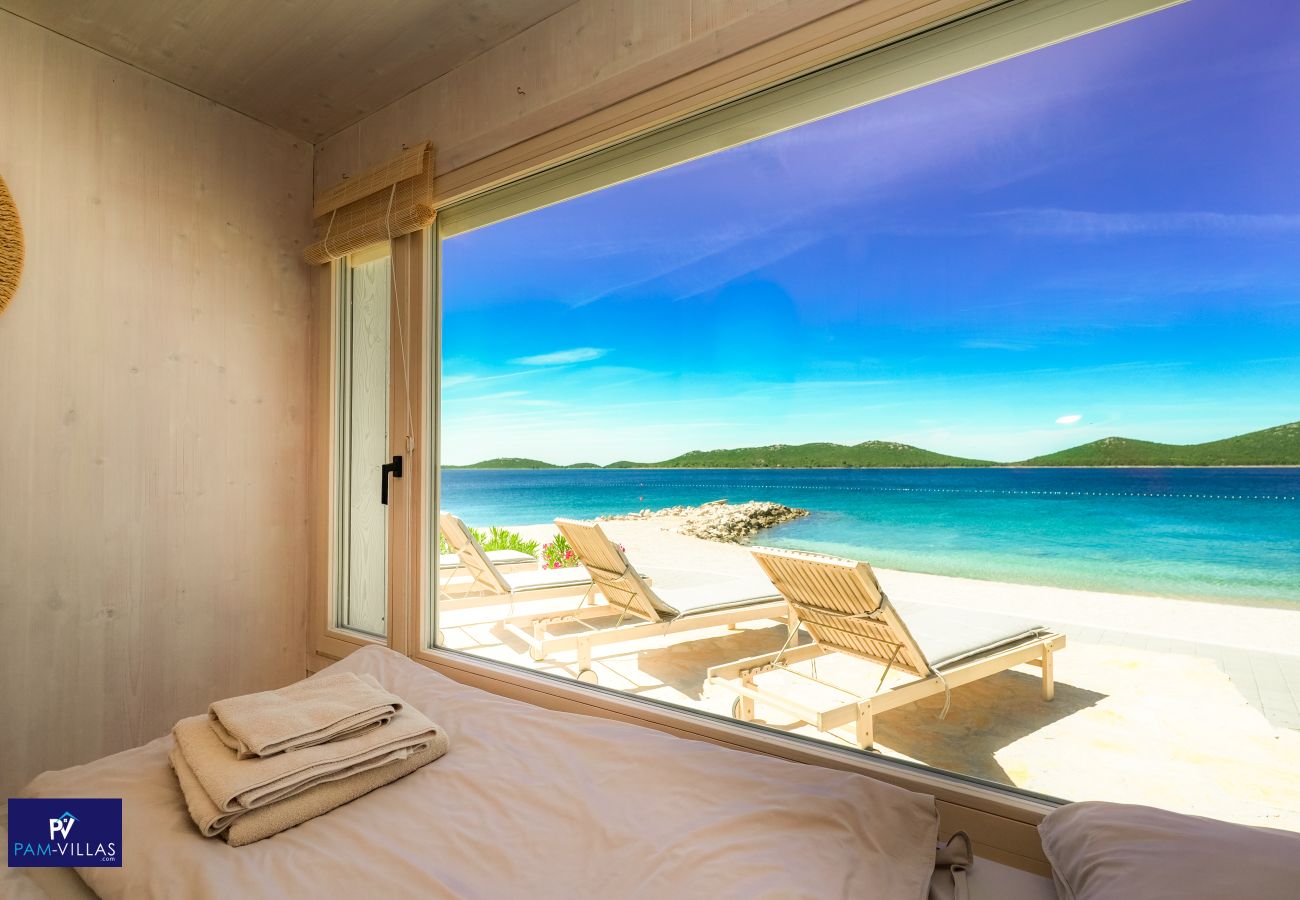 Ferienhaus in Drage - BUQEZ ECO RESORT - Villa 27 - Direkt am Strand